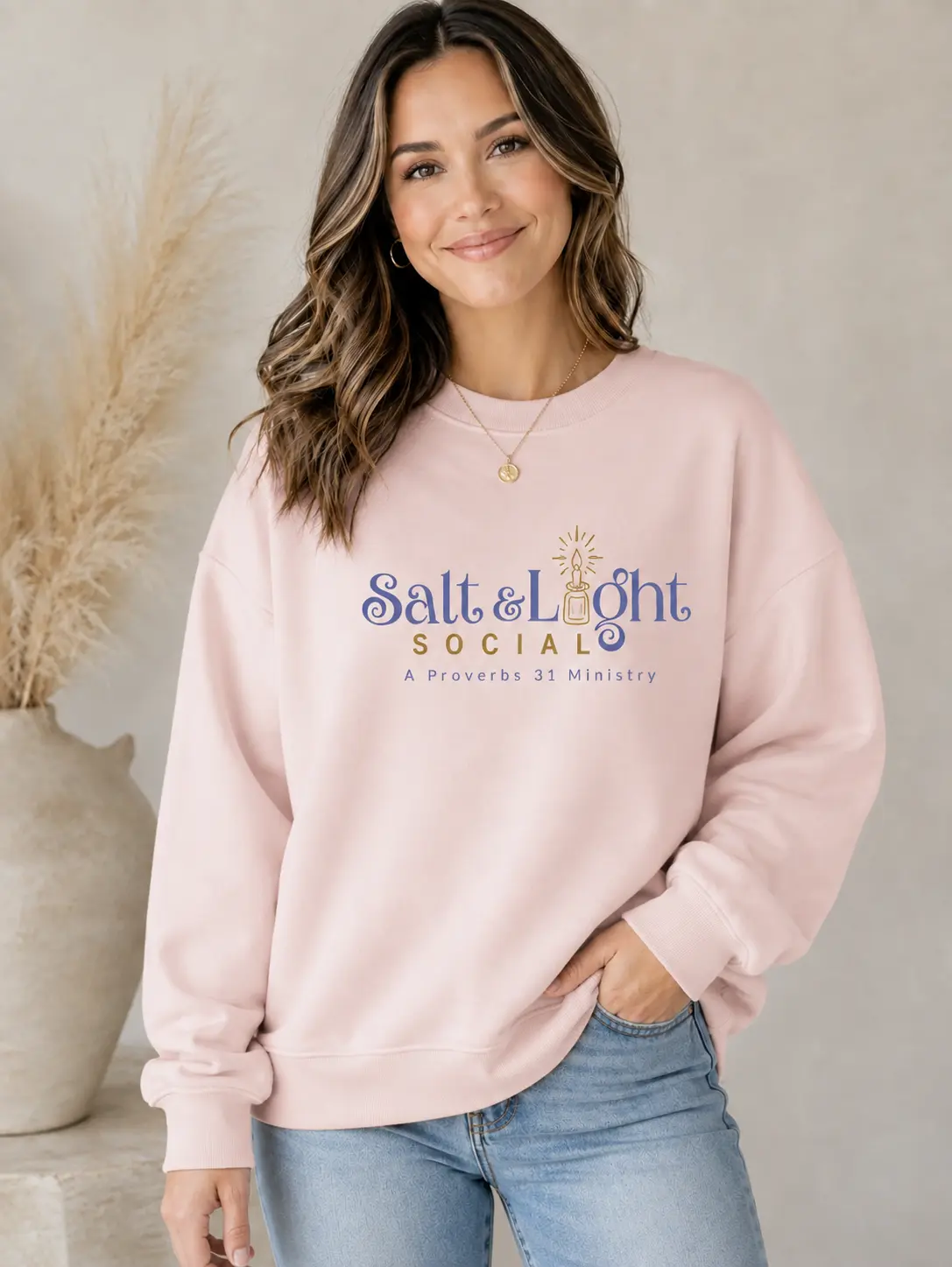 Salt and Light Social pink oversized sweatshirt with a large centered chest logo