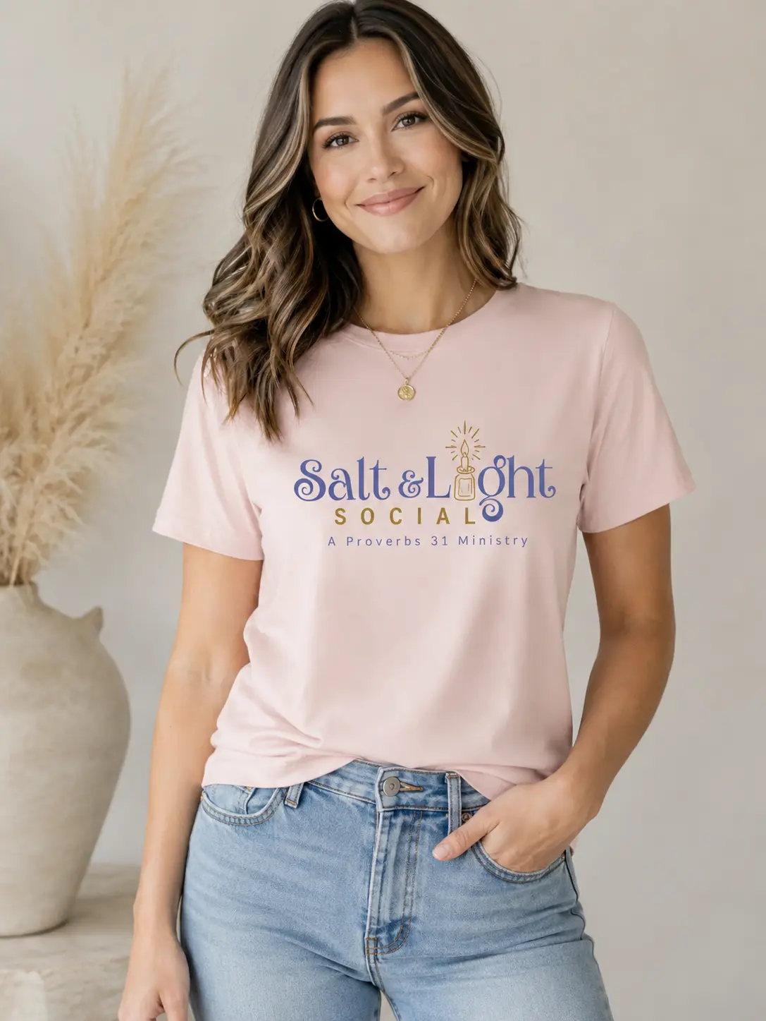 Salt and Light Social pink T-shirt with a large centered chest logo